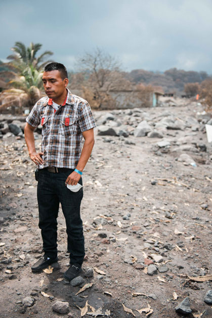 Julio Morazan stands at Ground Zero where his house once stood. The volcano took the lives of 12 of his family members.