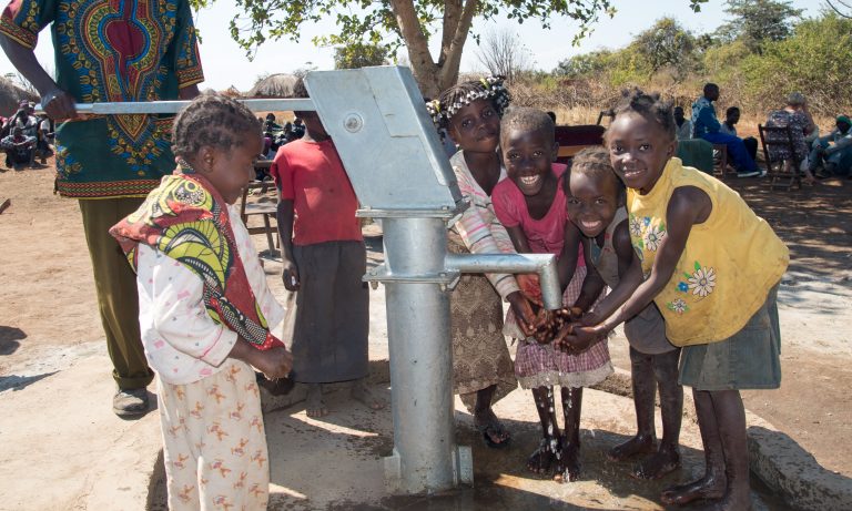 Kids at water well