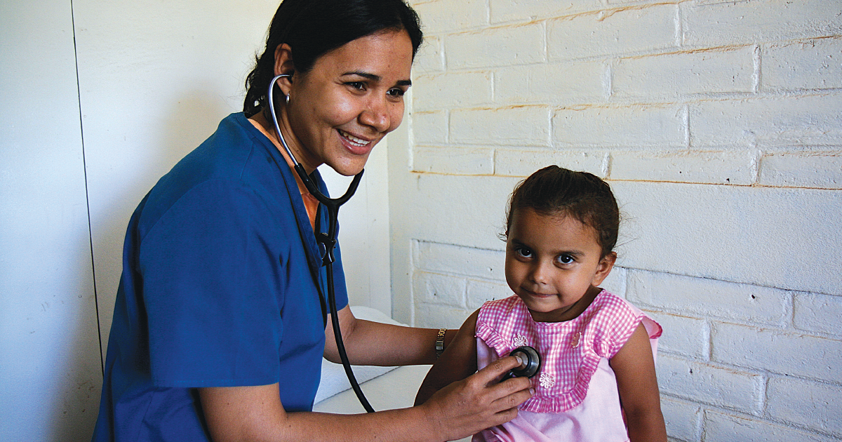 A child receives medical aid from a medical professional