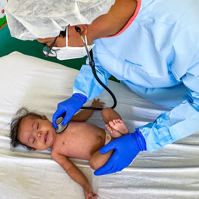 Baby Melani seen by a doctor at the Pediatric Nutritional Recovery Center
