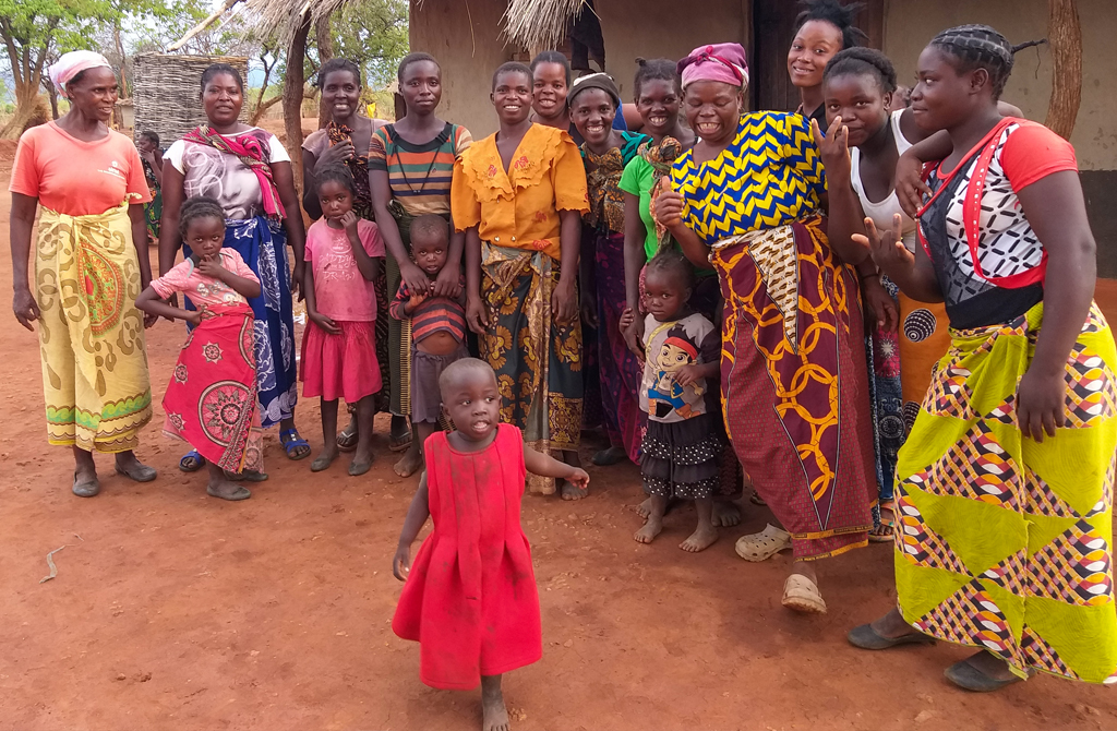 Ireen celebrating with other women in the Kamiza Village