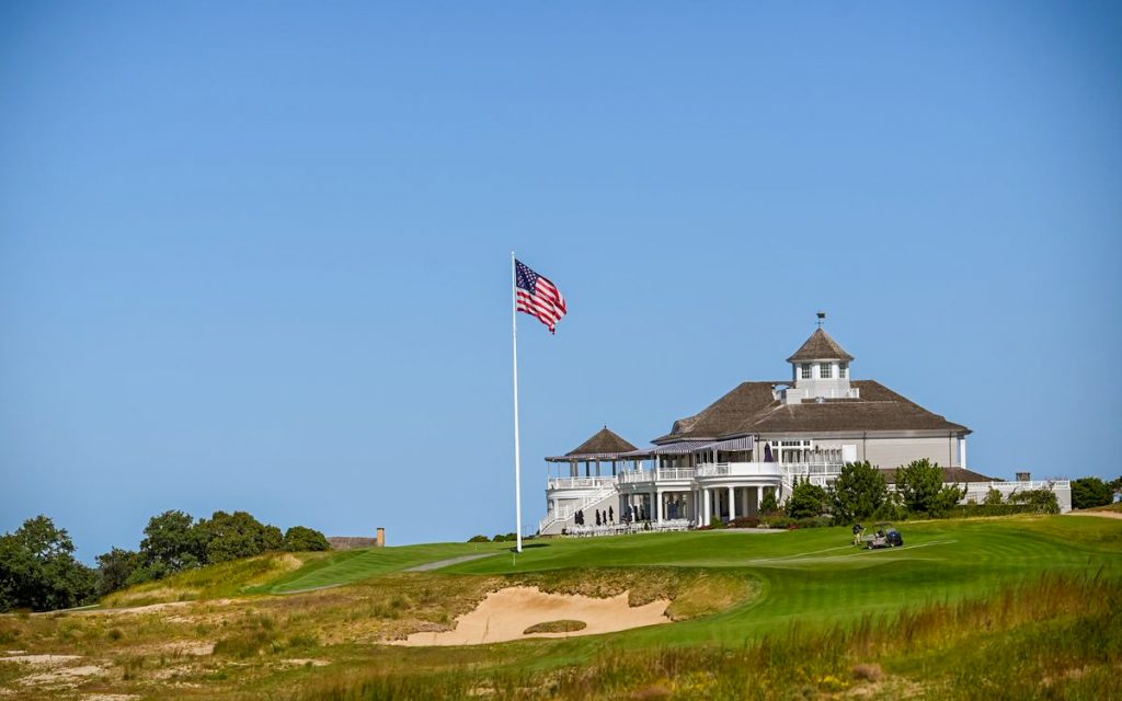 The American Flag waving over the golf course