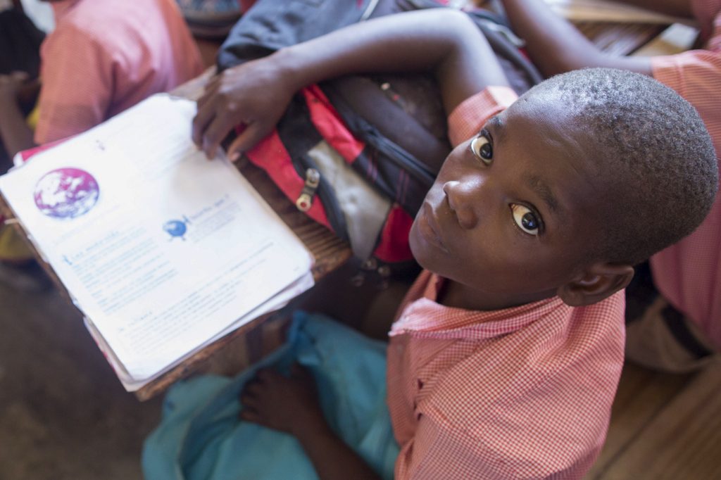 Boy in class at Rigaud - Divine Shelter School, Haiti