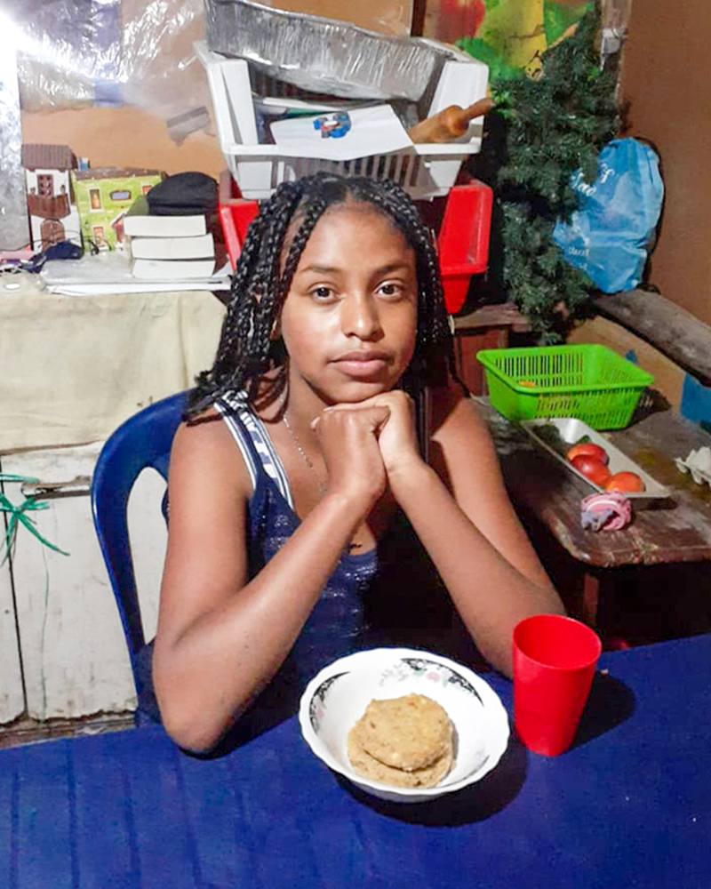 Ecuadorian girl receiving food