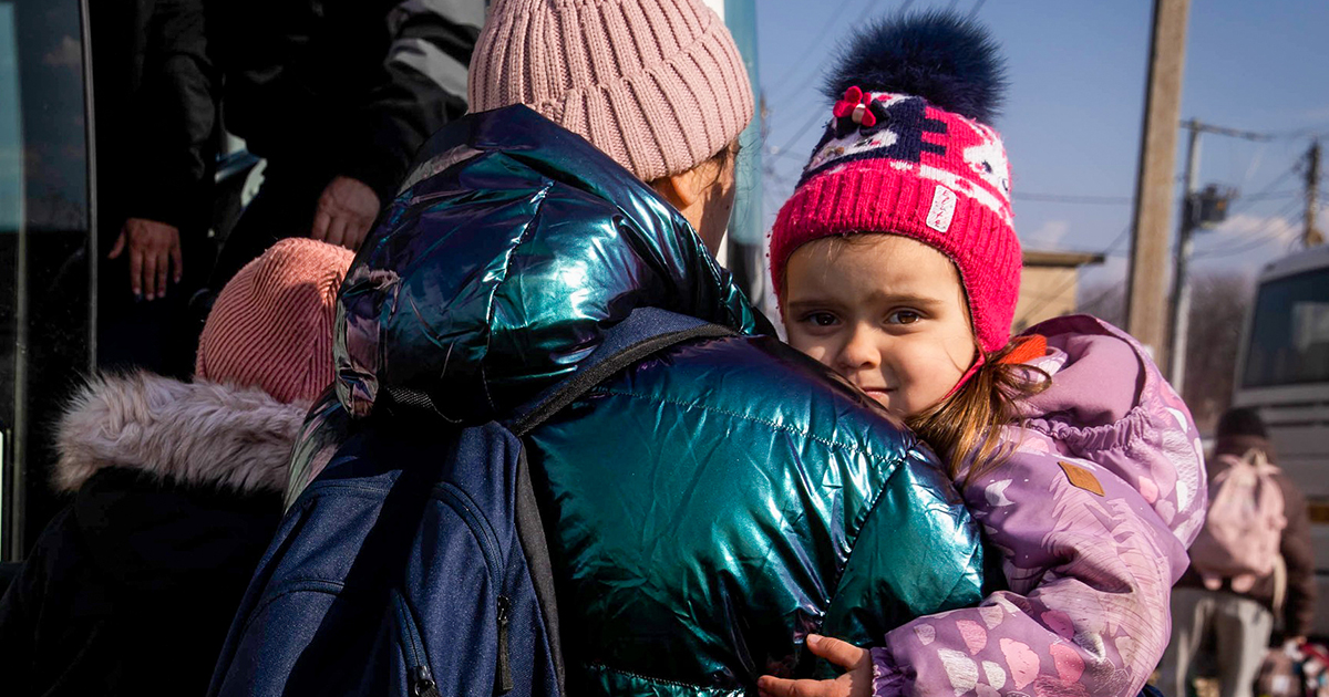 Ukrainian mother and child fleeing Ukraine