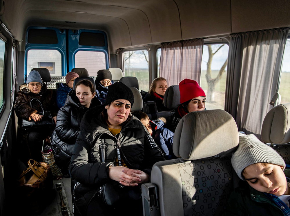 Ukrainian Mothers riding bus with their children