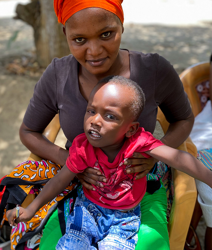 Kenyan mother holding her son