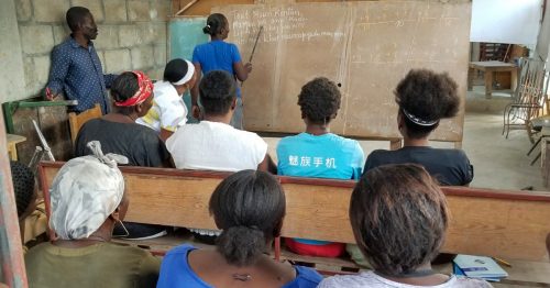 Group of people during class at Alfalit