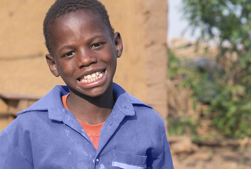 Malawian boy smiling to the camera