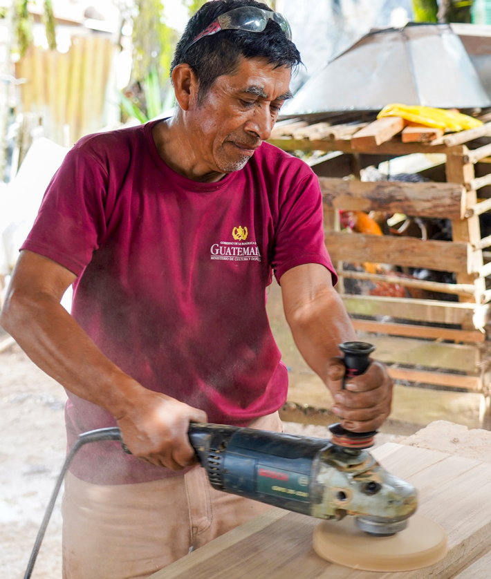 Don Fidel sanding wood