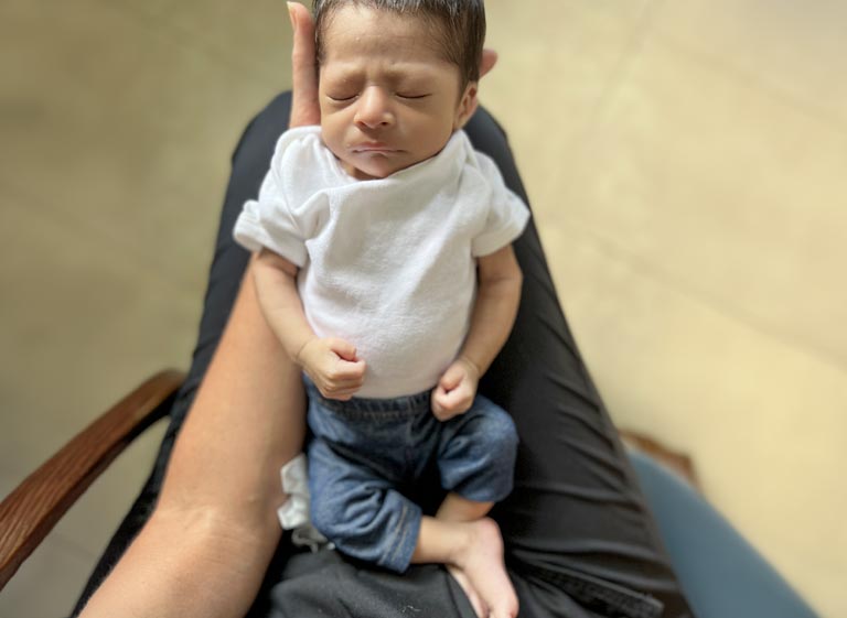 Malnourished baby now under the care of a local ministry in Guatemala