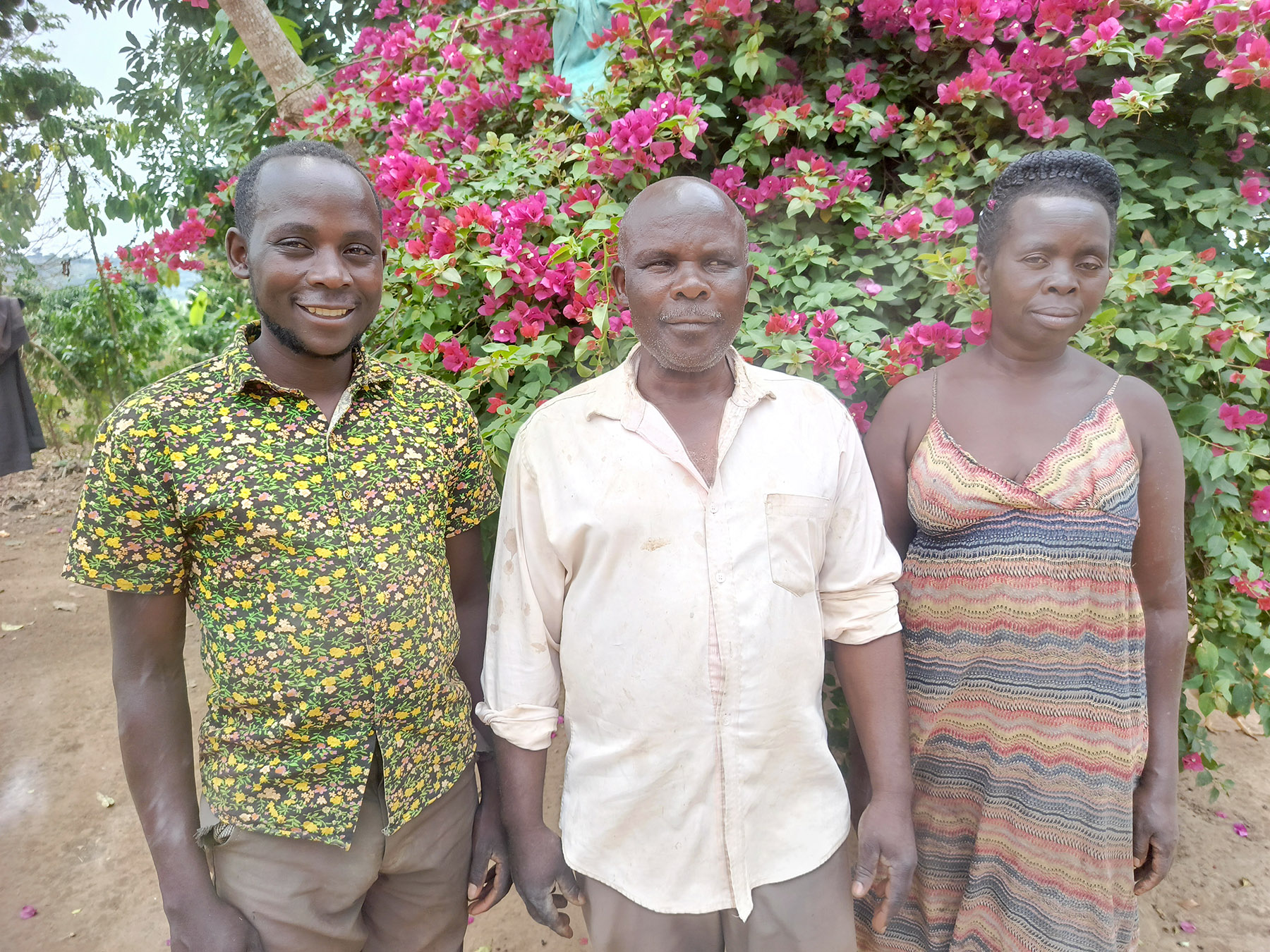 Lydia with others in rural Uganda after Cross International and Heed Uganda helped her get a new stove.