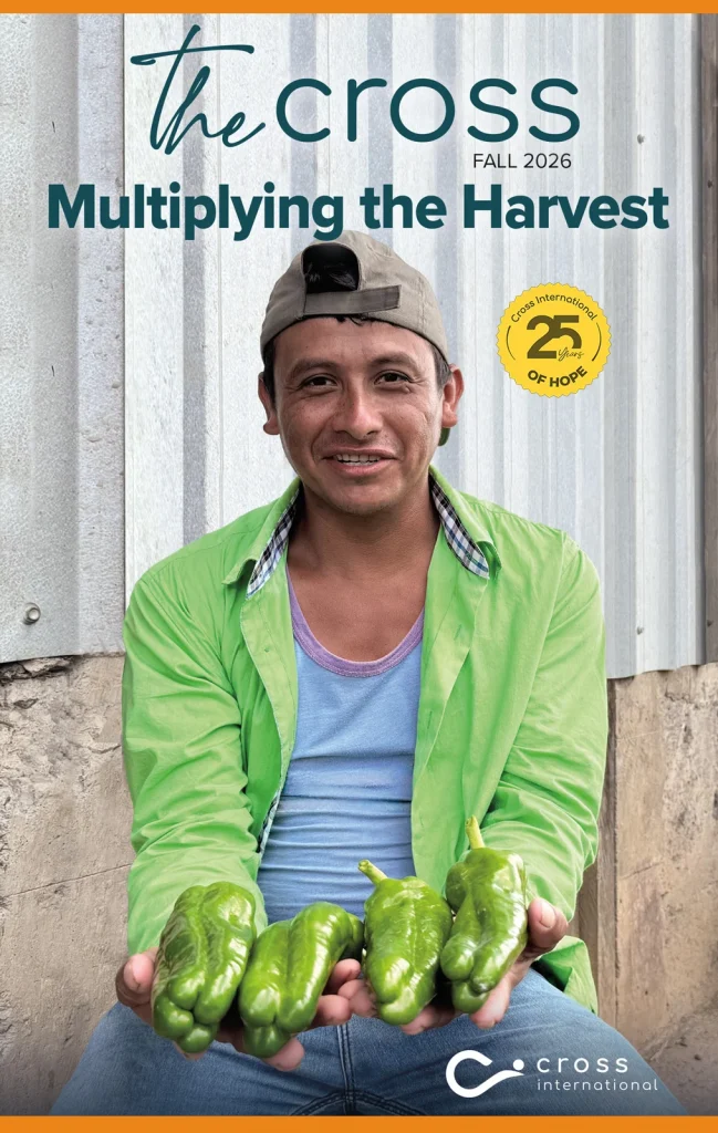 Fall 2026 issue of The Cross magazine featuring a farmer holding a harvest of green peppers, titled “Multiplying the Harvest."